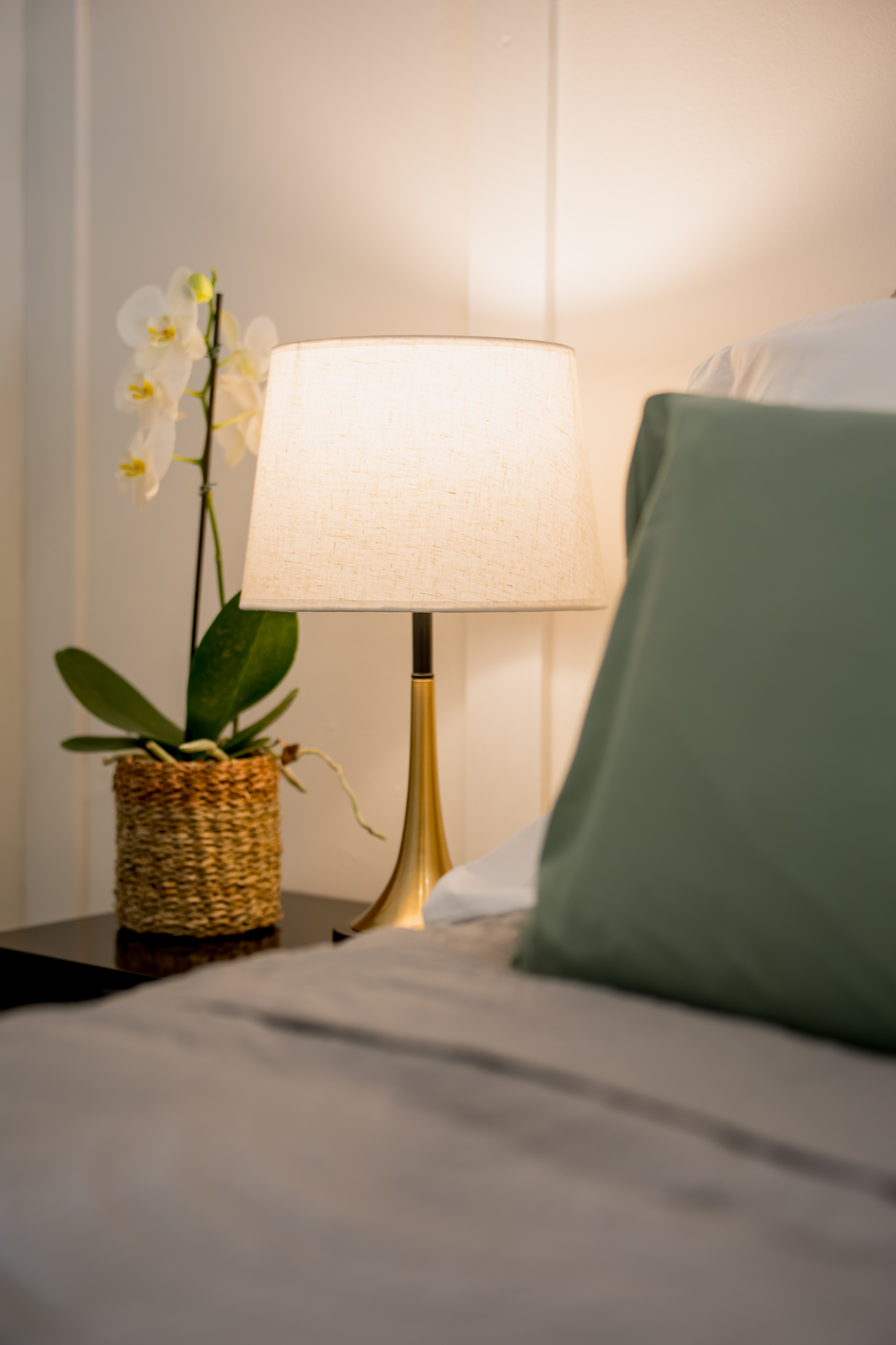 Bedside lamp by cushions