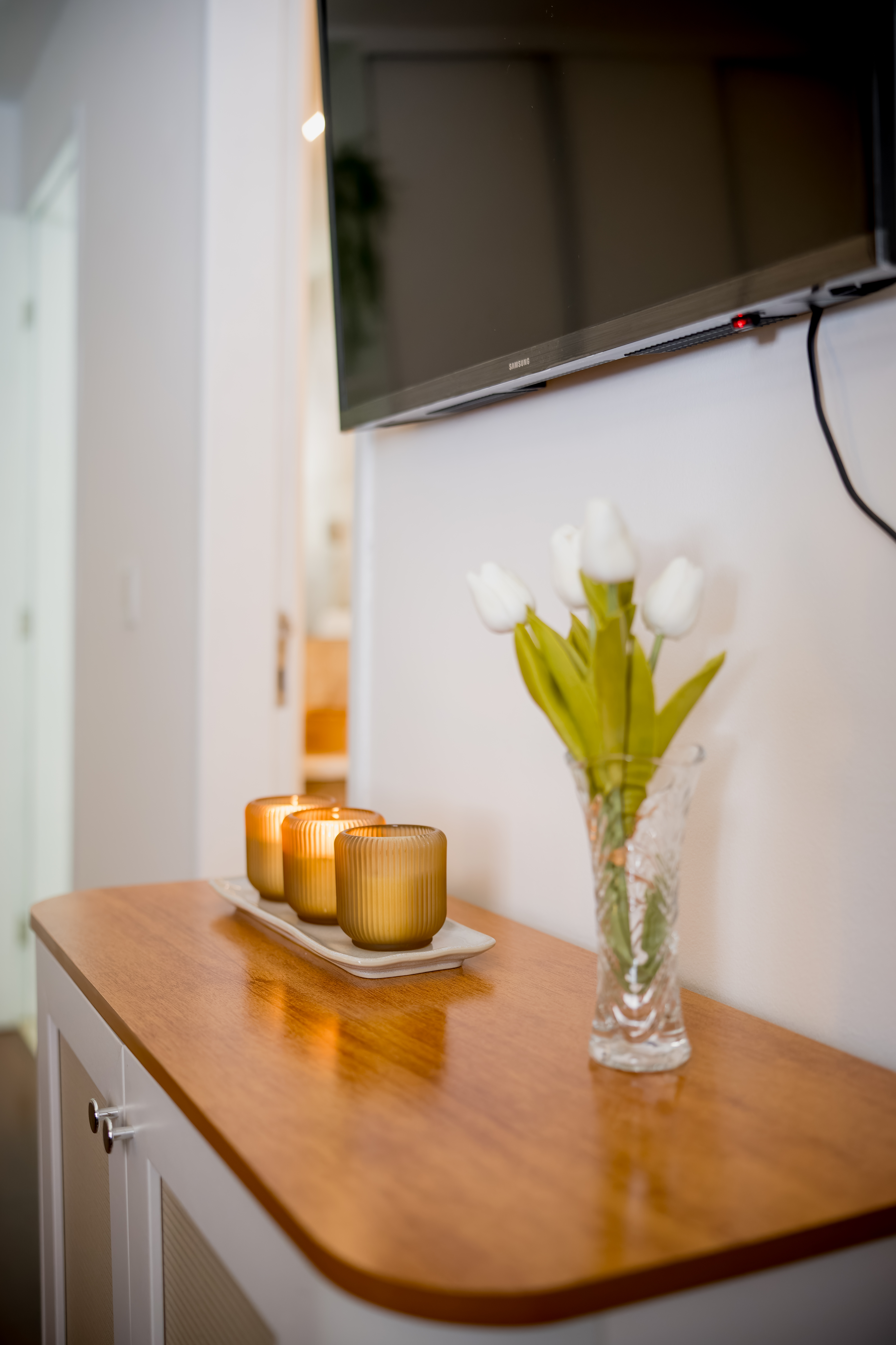 Sideboard with candles and flowers
